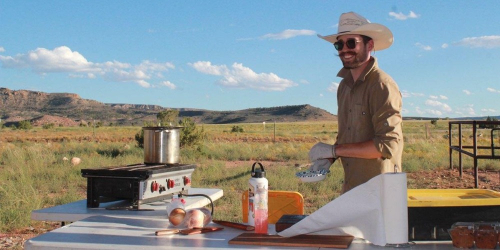 Nick Polhill Cooking at Camp